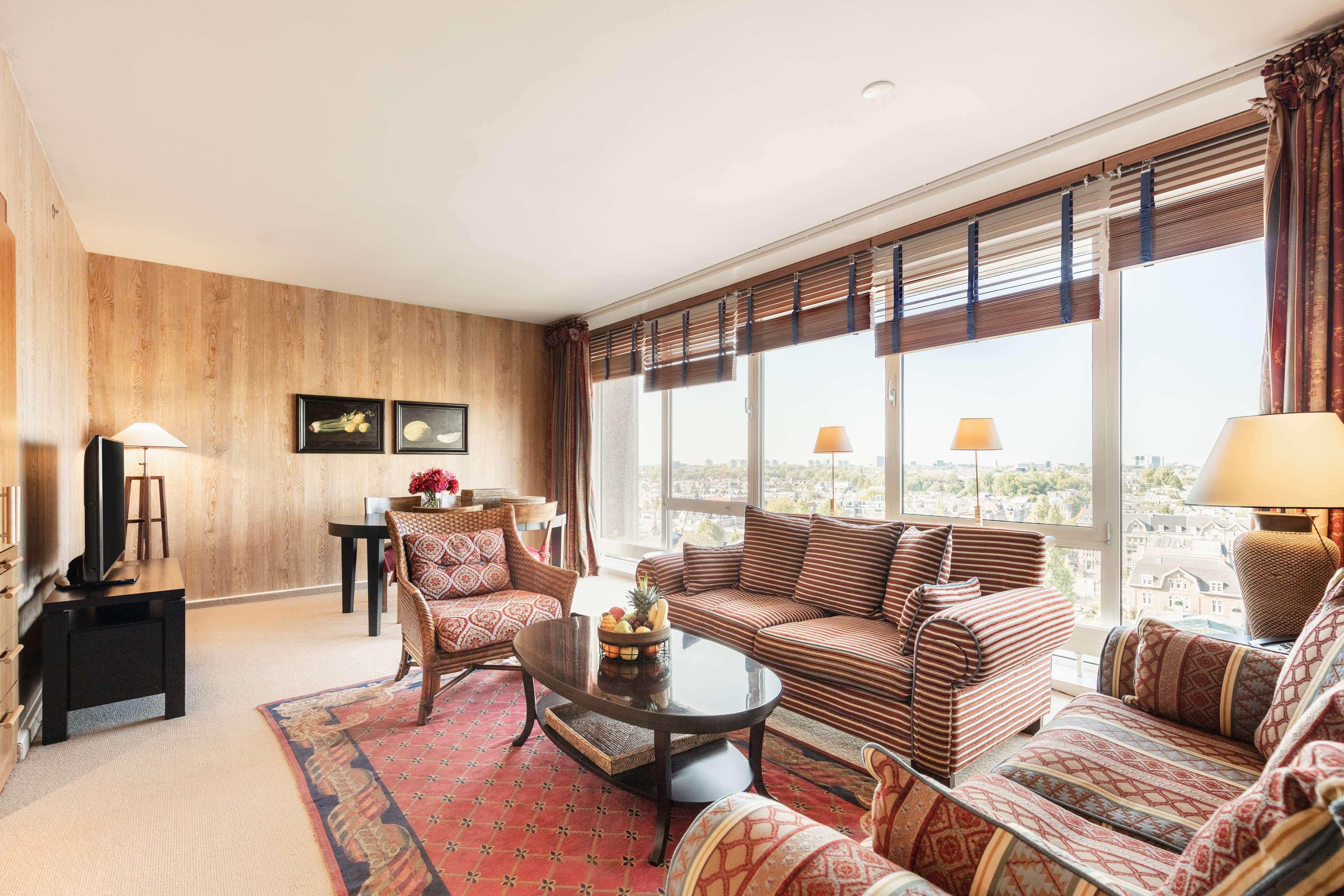 Hotel Hilton Amsterdam Esterno foto A living room at the Taj Mahal Palace, Mumbai
